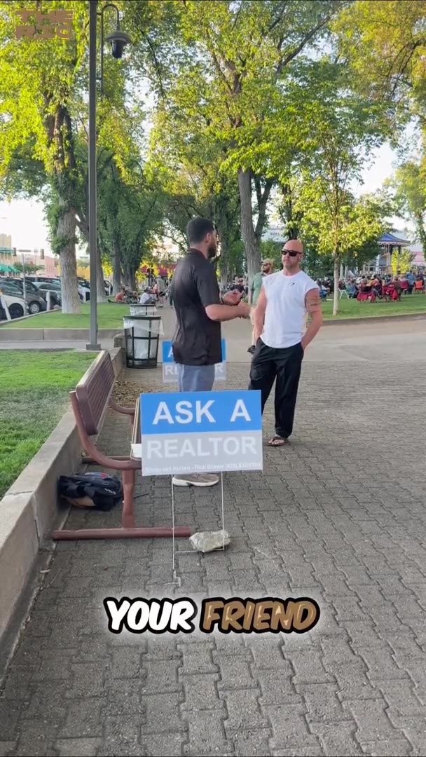 Shane van Huizen on a park bench answering questions